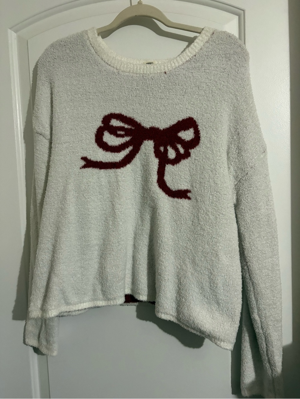 Cozy Cream Sweater with Red Bow Motif